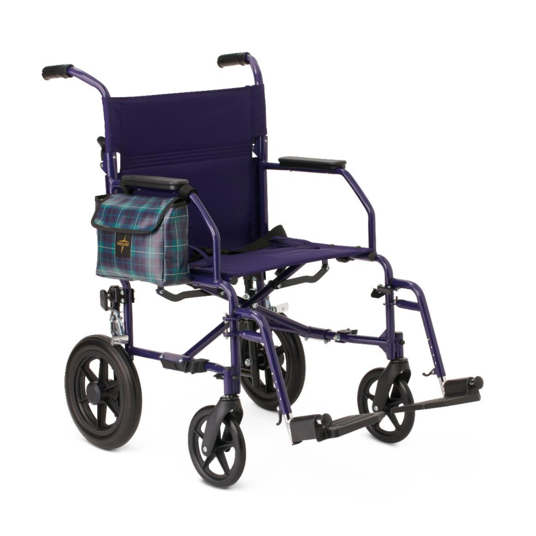 The Medline Designer High-Performance Transport Chair features a lightweight, foldable steel frame in purple, black seat and armrests, footrests, and a plaid blue-green side bag on the left armrest for comfortable mobility.
